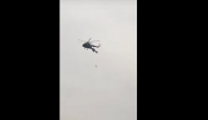 Man left dangling in air after his parachute gets caught on helicopter’s tail rotor [VIDEO]