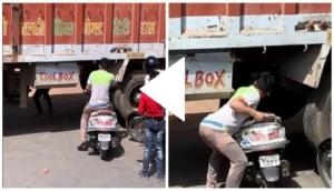Man finds a hilarious way to get his scooter out of traffic jam; video will tickle your funny bones!