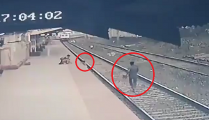 Horrifying Video: Man risks his life to save child from oncoming train