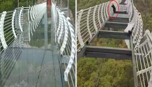 OMG! Man left clinging for life after sudden wind shatters glass-bridge; scary pics go viral