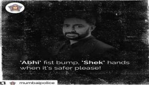 Abhishek Bachchan shares poster by Mumbai Police: 'Abhi' fist bump, 'Shek' hands later please!'