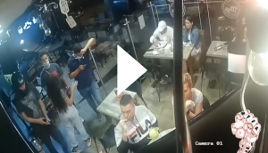 Man continues to eat his chicken wing during robbery at restaurant; hilarious incident goes viral