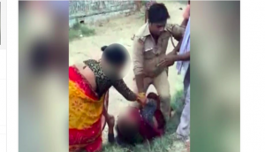 Misleading image of UP police officer pinning down woman goes viral; know the truth