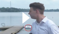 Car without driver sinks into a lake; cameraman records awestruck visual