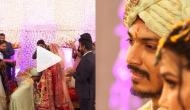 Groom surprises bride during varmala ceremony; video will make you fall in love!