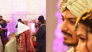 Groom surprises bride during varmala ceremony; video will make you fall in love!