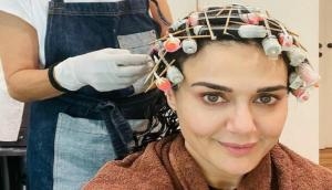 Preity Zinta restarts love affair with curls