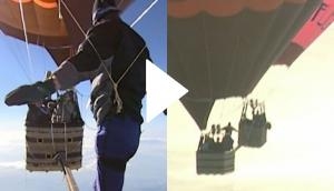 Man walks between two hot air balloons; video will give you sleepless nights