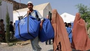 'Children need food at night in Afghanistan': People forced to sell household items on the streets in Kabul