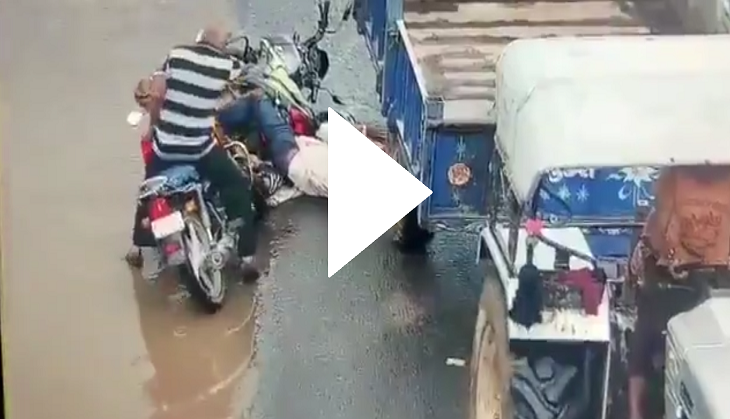 Tractor-trolley moves over bike rider's head; spine-chilling video goes viral