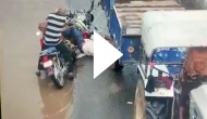 Tractor-trolley moves over bike rider's head; spine-chilling video goes viral