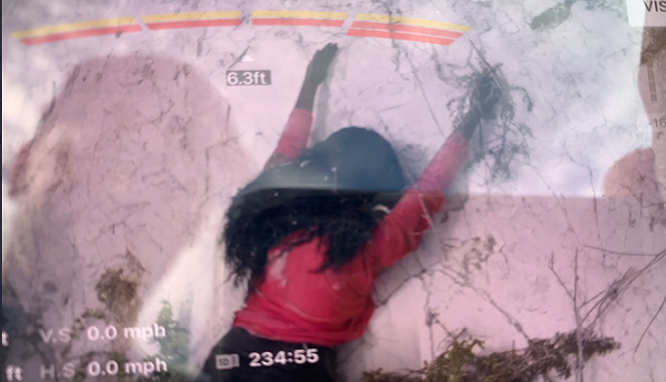 Passersby call firefighters to rescue woman hanging off cliff; what happens next is weird