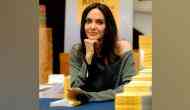 Angelina Jolie's giraffe look from pre-pandemic Halloween party goes viral