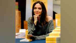 Angelina Jolie's giraffe look from pre-pandemic Halloween party goes viral