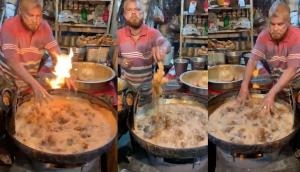 Man dips hand in hot oil to fry chicken; video will leave you stunned