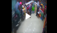 Speeding bike loses control and crashes into clothing store; terrifying moment captured on cam
