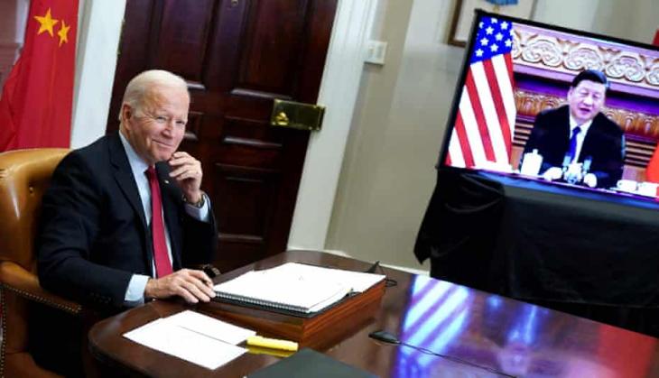 Biden tells Xi at virtual summit: All countries have to play by same rules of road