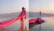 Woman falls from swing while getting photoshoot done in saree; hilarious video goes viral