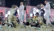 Man showers bucket full of currency notes on this singer; video will leave you rubbing your eyes in disbelief
