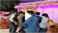 Bride and groom left shocked after friends bring huge gift on stage; video will give you dose of laughter