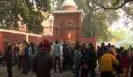 COVID-19 pandemic: Delhi's Sacred Heart Cathedral remains close, people light candles at back gate