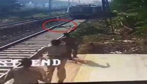 Caught on cam: Man narrowly escapes death after train driver hits emergency brakes in nick of time