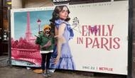 Lily Collins reacts to graffiti on poster of 'Emily in Paris'