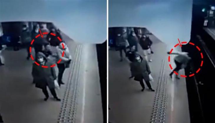 Woman intentionally pushed in front of train, watch hair-raising video 