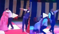 Oh No! Man tries to lift her wife while performing on dance floor; watch hilarious video