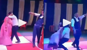 Oh No! Man tries to lift her wife while performing on dance floor; watch hilarious video