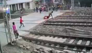 Watch: Heart-stopping video captures motorcyclist's narrow escape from train 
