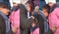 Ukrainian man bids farewell to his little girl and stays behind to fight, watch emotional moment