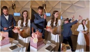 Groom and bride left shocked after man smashes cake on their faces; watch full drama