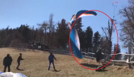 Spine-chilling video shows paraglider crashing into fence