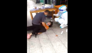 Chinese woman pinned down by man for COVID test, swab sample taken forcibly [Watch] 