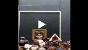 Man disguised as old woman smears cake on Mona Lisa; video goes viral