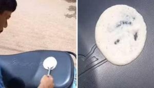 Hyderabad man makes dosa on the seat of his scooter as temperature soars [Watch]