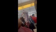 Video of woman stepping over passengers to get her window seat mid-flight goes viral