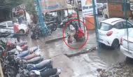 Couple on two-wheeler falls into water filled pit; shocking video goes viral