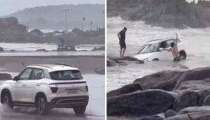 Tourists drive car through Goa beach; netizens blast them for irresponsible act [Watch]