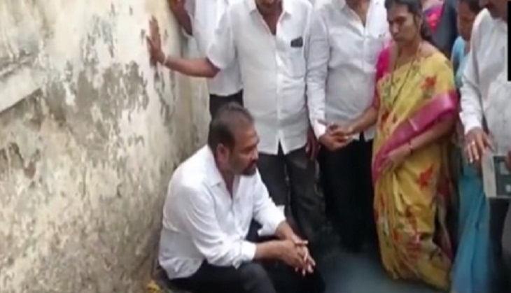 YSRCP MLA enters open drain as mark of protest against civic authorities