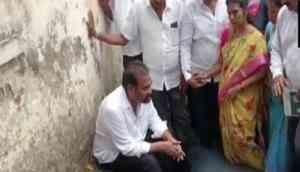 YSRCP MLA enters open drain as mark of protest against civic authorities