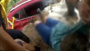 Cops rescue woman stuck inside car amid Arizona floods; watch dramatic video