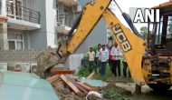 UP: Bulldozers demolish illegal construction at home of man who misbehaved with woman at Noida society