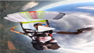 Skydiver opens a box of pie mid-air; watch what happens next