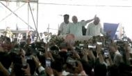 PM Modi holds roadshow in Surat, waves to people gathered to greet him
