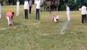 Watch: BJP leader falls flat on his face as he runs away from cracker; video goes viral