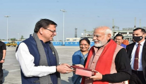 Uttarkhand CM gifts PM Modi a traditional cap carved with Brahma Kamal