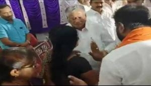 Karnataka minister slaps woman on stage; she then touches his feet [WATCH]