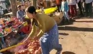 Viral Video: Woman vandalises diya stalls with floor wiper in Lucknow